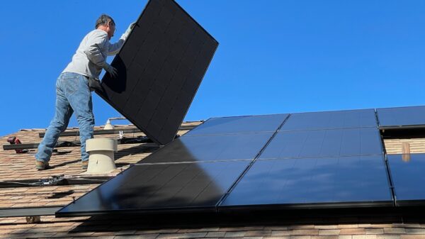 Worker installing solar panels